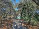 Quaint guest house with teal exterior and screened porch at 8934 Sandy Creek Rd, Edisto Island, SC 29438