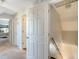 Upper level hallway with access to bedrooms and additional storage at 8934 Sandy Creek Rd, Edisto Island, SC 29438