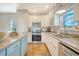 Modern kitchen featuring stainless steel appliances and granite countertops at 8934 Sandy Creek Rd, Edisto Island, SC 29438