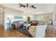 Open concept living room and kitchen with leather sofas and hardwood floors at 8934 Sandy Creek Rd, Edisto Island, SC 29438