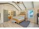 Bedroom with vaulted ceiling and wicker bed frame at 8934 Sandy Creek Rd, Edisto Island, SC 29438