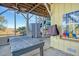 Covered patio with ping pong table,cornhole and kayaks at 8934 Sandy Creek Rd, Edisto Island, SC 29438