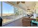 Relaxing screened porch with wicker furniture and marsh views at 8934 Sandy Creek Rd, Edisto Island, SC 29438