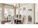 Elegant dining room with a statement wall and hardwood floors at 102 Black Stilt Way, Summerville, SC 29483