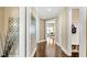 Bright hallway with hardwood floors and access to other rooms at 102 Black Stilt Way, Summerville, SC 29483