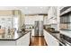 Spacious kitchen with white cabinets, granite countertops, and stainless steel appliances at 102 Black Stilt Way, Summerville, SC 29483