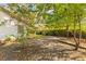 Large backyard with gravel and trees at 109 Salem Ct, Summerville, SC 29486