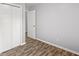 Bedroom with grey walls, wood-look flooring, and a closet at 109 Salem Ct, Summerville, SC 29486