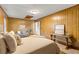 Bedroom with wood paneled walls, a comfy bed, and a couch at 109 Salem Ct, Summerville, SC 29486