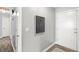 Bright entryway with grey walls, wood-look floors and a modern painting at 109 Salem Ct, Summerville, SC 29486