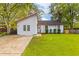 White house with green lawn, driveway and mature trees at 109 Salem Ct, Summerville, SC 29486