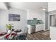 Eat-in kitchen with white cabinets, glass table, and wood floors at 109 Salem Ct, Summerville, SC 29486