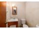Small bathroom with vintage vanity, toilet and wallpaper at 1134 S Shadow Dr, Mount Pleasant, SC 29464