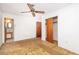 Empty bedroom with carpet, ceiling fan, and small bathroom at 1134 S Shadow Dr, Mount Pleasant, SC 29464