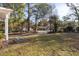 Front yard with mature trees and grassy lawn at 1134 S Shadow Dr, Mount Pleasant, SC 29464