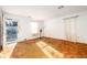 Living room with worn carpet and a door to the outside at 1134 S Shadow Dr, Mount Pleasant, SC 29464