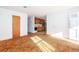 Living room with worn carpet and a view of the kitchen at 1134 S Shadow Dr, Mount Pleasant, SC 29464