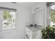 Modern bathroom with marble vanity and window at 124 Mary St, Mount Pleasant, SC 29464