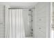 Clean bathroom with shower/tub combo and white subway tile at 124 Mary St, Mount Pleasant, SC 29464