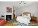 Charming bedroom with fireplace, hardwood floors, and plenty of natural light at 124 Mary St, Mount Pleasant, SC 29464