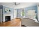 Cozy bedroom with hardwood floors, fireplace and window seat at 124 Mary St, Mount Pleasant, SC 29464