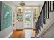 Spacious entryway with hardwood floors, built-in shelving, and staircase at 124 Mary St, Mount Pleasant, SC 29464