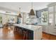 Gourmet kitchen with marble island, custom cabinetry, and breakfast area at 124 Mary St, Mount Pleasant, SC 29464