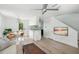 Open living room and kitchen with modern finishes and light flooring at 124 Mary St, Mount Pleasant, SC 29464