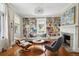 Cozy living room with built-in bookshelves, fireplace, and comfortable seating at 124 Mary St, Mount Pleasant, SC 29464