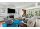 Open living room with large sectional sofa, fireplace and hardwood floors at 124 Mary St, Mount Pleasant, SC 29464