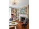 Living room with built-in bookshelves, fireplace, and mid-century modern furniture at 124 Mary St, Mount Pleasant, SC 29464