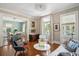 Spacious living room with a view into the dining room and access to the outdoors at 124 Mary St, Mount Pleasant, SC 29464