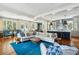 Spacious living room and kitchen with hardwood floors, and blue rug at 124 Mary St, Mount Pleasant, SC 29464
