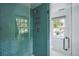 Spa-like shower with teal tile and glass enclosure at 124 Mary St, Mount Pleasant, SC 29464