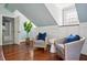 Charming sitting area with two armchairs and built-in shelving at 124 Mary St, Mount Pleasant, SC 29464