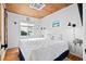 Bedroom with king-size bed and coastal decor at 1306 Palmetto Blvd, Edisto Beach, SC 29438