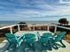 Ocean view from deck with seating for three at 1306 Palmetto Blvd, Edisto Beach, SC 29438