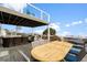 Large deck with outdoor dining and seating overlooking the pool at 1306 Palmetto Blvd, Edisto Beach, SC 29438