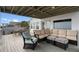 Relaxing deck with seating area and outdoor dining furniture at 1306 Palmetto Blvd, Edisto Beach, SC 29438