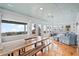 Bright dining area with wooden table and ocean views at 1306 Palmetto Blvd, Edisto Beach, SC 29438