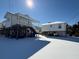 Two elevated beach homes with snow-covered ground at 1306 Palmetto Blvd, Edisto Beach, SC 29438
