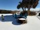 Cozy firepit area with teal chairs, surrounded by snow at 1306 Palmetto Blvd, Edisto Beach, SC 29438