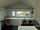 Charming kitchen featuring a farm sink, ample counter space, and view at 1306 Palmetto Blvd, Edisto Beach, SC 29438