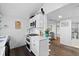 Modern white kitchen with stainless steel appliances and island at 1306 Palmetto Blvd, Edisto Beach, SC 29438