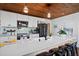 Bright kitchen with white cabinets, island, and stainless steel appliances at 1306 Palmetto Blvd, Edisto Beach, SC 29438