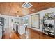 Open concept kitchen with hardwood floors and a coffee bar at 1306 Palmetto Blvd, Edisto Beach, SC 29438