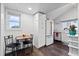 Small kitchen with white cabinets and breakfast nook at 1306 Palmetto Blvd, Edisto Beach, SC 29438