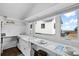 Kitchen with white cabinets and ocean views at 1306 Palmetto Blvd, Edisto Beach, SC 29438