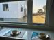 Bright kitchen featuring elegant countertops and a scenic view of the beach outside the window at 1306 Palmetto Blvd, Edisto Beach, SC 29438
