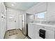 Laundry room with washer, dryer, and extra refrigerator at 1306 Palmetto Blvd, Edisto Beach, SC 29438